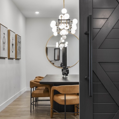 a private lounge and meeting room with a large table